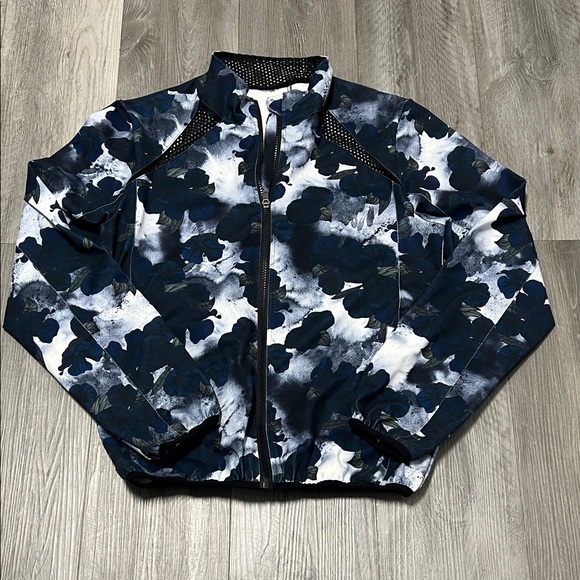 ZYIA Jackets & Blazers - Zyia Active Pro Trainer full-zip jacket in a blue and black floral pattern./ L